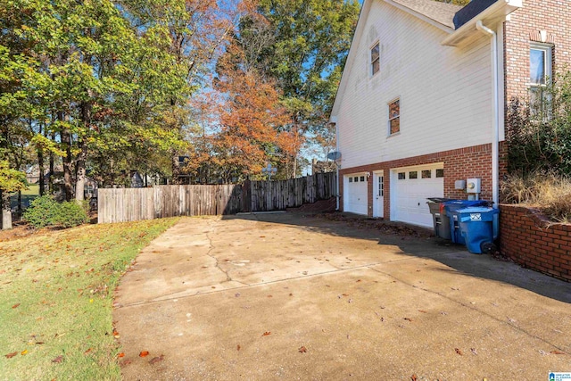 view of side of home featuring a garage