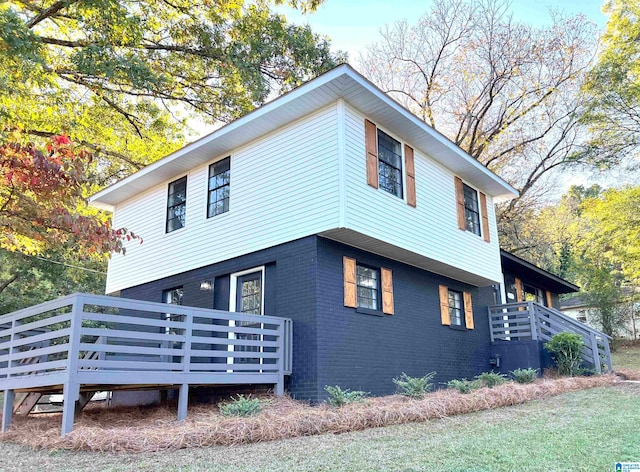 view of home's exterior with a deck