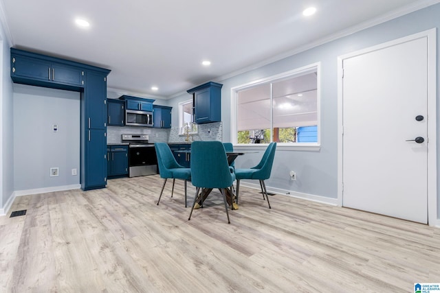 dining space featuring light hardwood / wood-style floors and ornamental molding