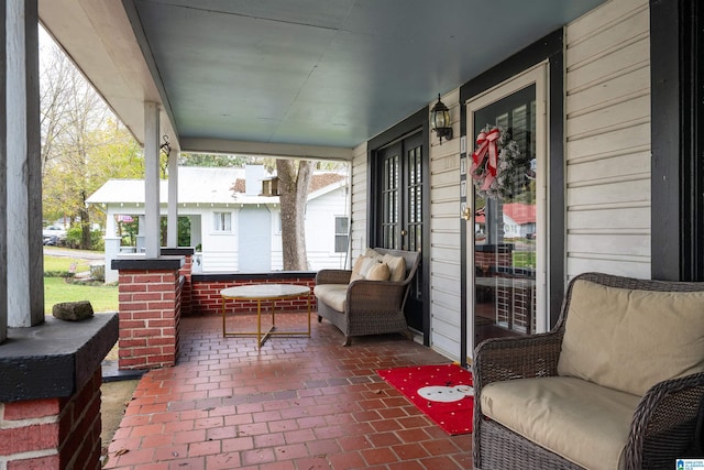 view of patio featuring a porch