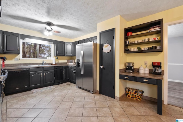 kitchen featuring dishwasher, sink, stainless steel fridge with ice dispenser, a textured ceiling, and light tile patterned floors