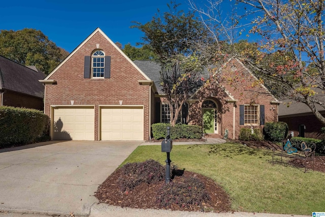 traditional-style home featuring a front lawn, brick siding, and driveway