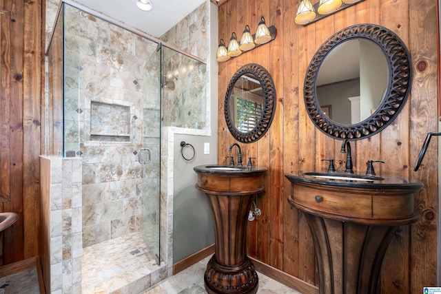 bathroom with a shower with shower door and wooden walls