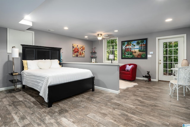 bedroom featuring access to exterior, ceiling fan, and hardwood / wood-style floors