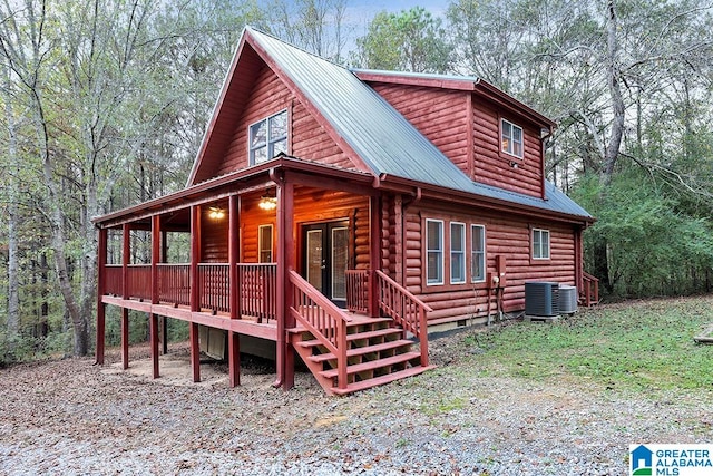 view of front facade with french doors and central AC unit