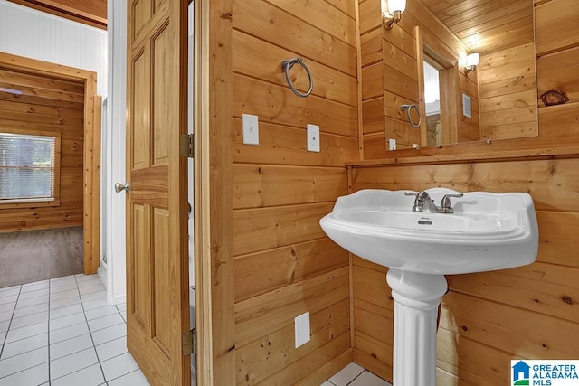 bathroom with tile patterned floors, wooden ceiling, and wood walls