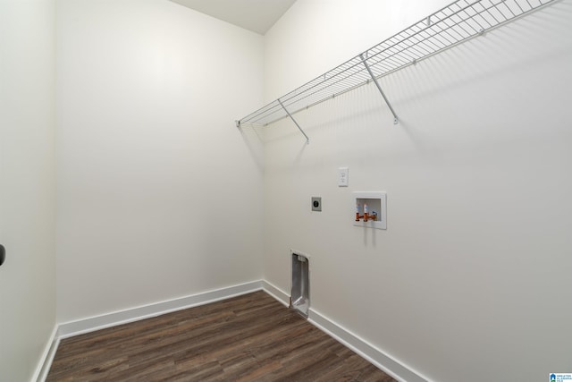 washroom with electric dryer hookup, hookup for a washing machine, and dark hardwood / wood-style flooring