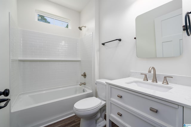 full bathroom featuring vanity, toilet, wood-type flooring, and bathtub / shower combination