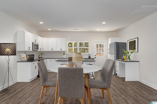 dining room with dark wood-type flooring