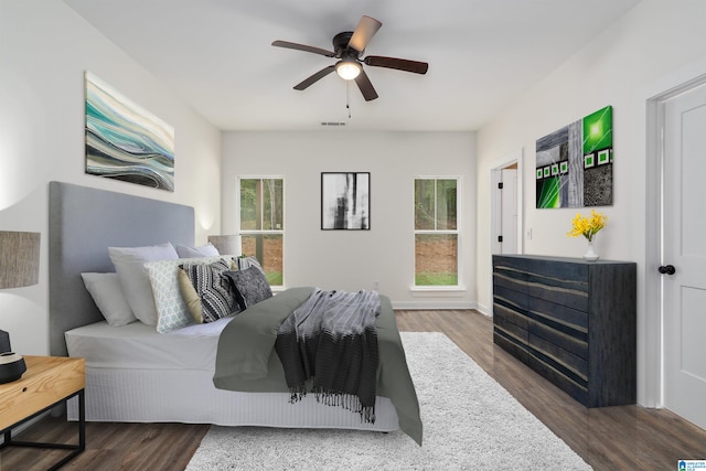 bedroom with hardwood / wood-style flooring and ceiling fan