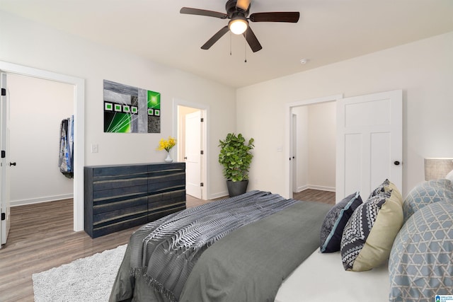 bedroom featuring ceiling fan and hardwood / wood-style floors