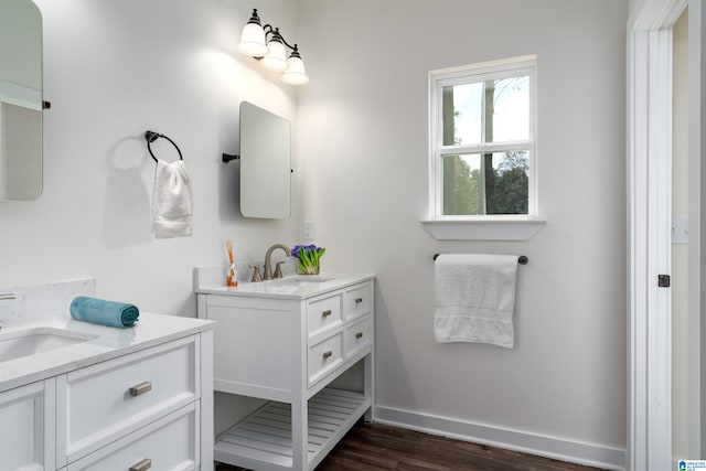 bathroom with hardwood / wood-style floors and vanity