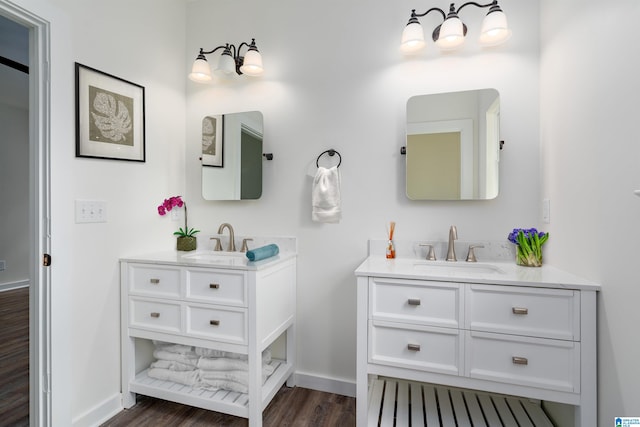 bathroom featuring vanity and hardwood / wood-style flooring