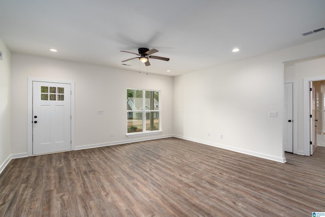 interior space featuring ceiling fan and dark hardwood / wood-style floors