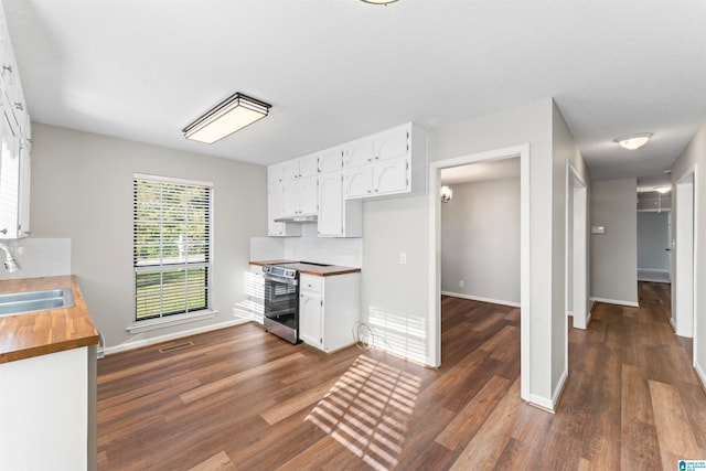 kitchen featuring white cabinets and dark hardwood / wood-style flooring