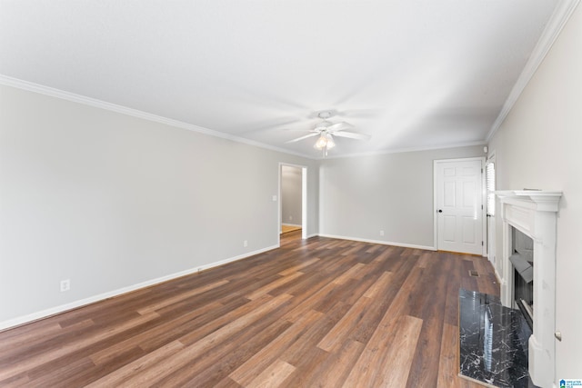 unfurnished living room featuring ceiling fan, ornamental molding, and dark wood-type flooring