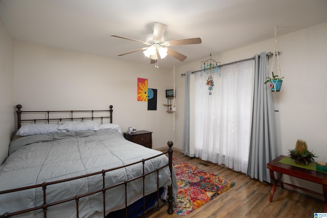 bedroom featuring ceiling fan and hardwood / wood-style flooring