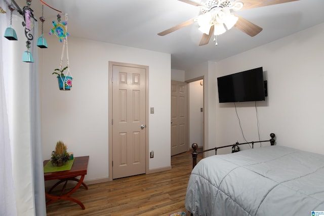 bedroom with ceiling fan and hardwood / wood-style floors