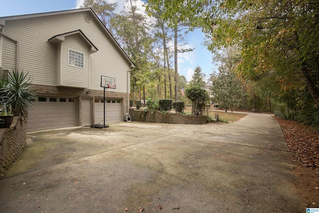 view of property exterior featuring a garage