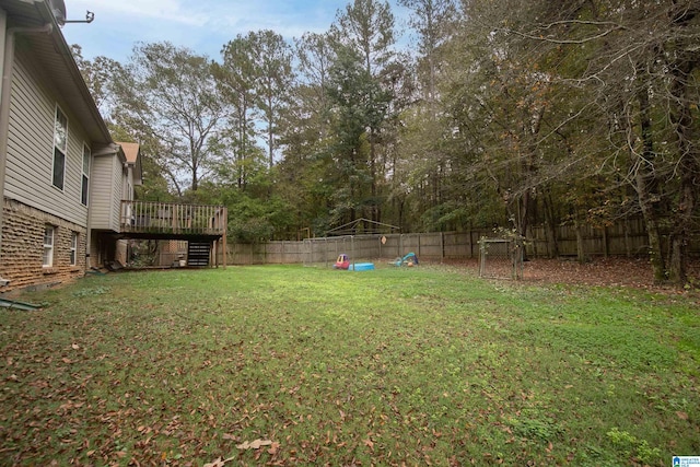 view of yard featuring a wooden deck