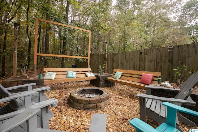 view of patio / terrace featuring an outdoor fire pit