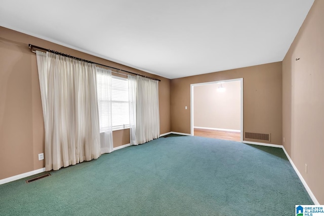 spare room featuring carpet floors