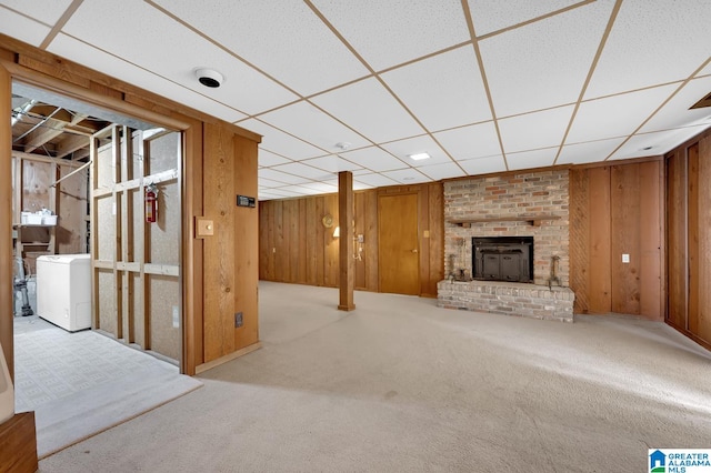 interior space featuring light carpet and wood walls