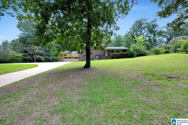 view of yard featuring a garage