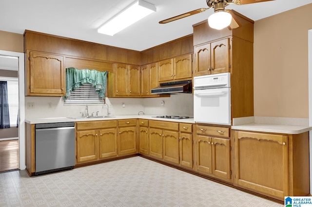 kitchen with ceiling fan, sink, and white appliances