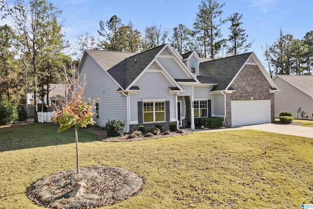 craftsman-style house featuring a front lawn and a garage