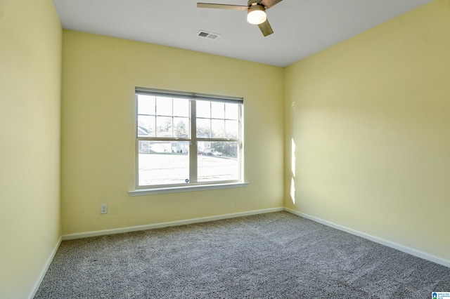 carpeted empty room featuring ceiling fan