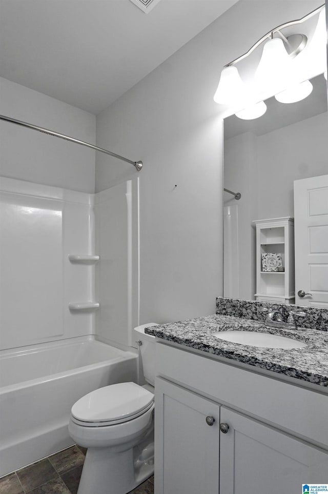 full bathroom featuring vanity, tub / shower combination, and toilet