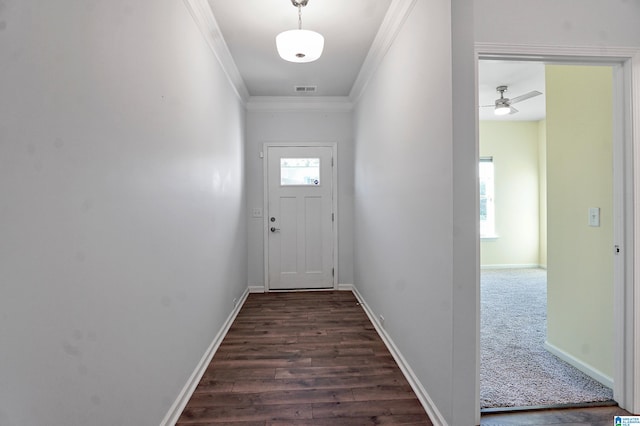 doorway to outside featuring ornamental molding, ceiling fan, and dark wood-type flooring