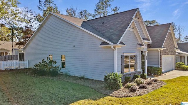 view of property exterior featuring a lawn