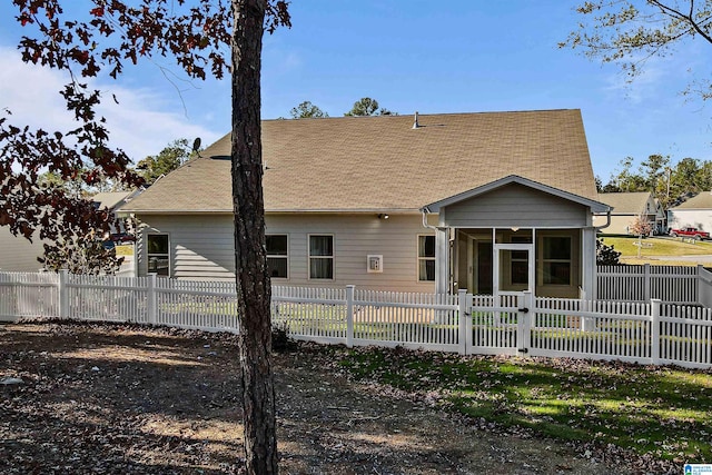 back of property featuring a sunroom