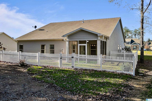 back of property featuring a sunroom