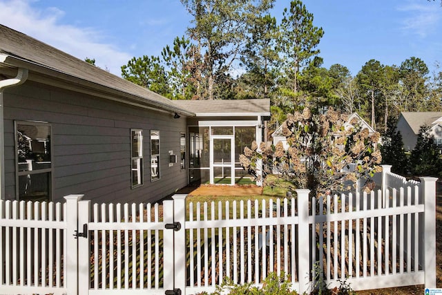 view of front of house featuring a sunroom