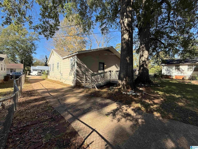 rear view of property with a wooden deck