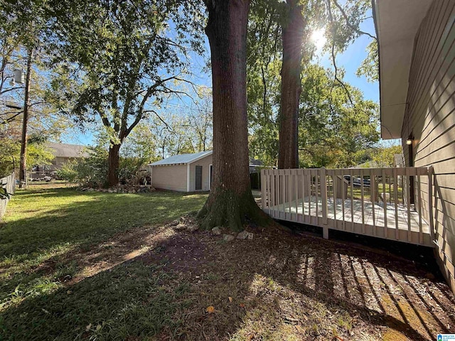 view of yard with an outdoor structure and a deck