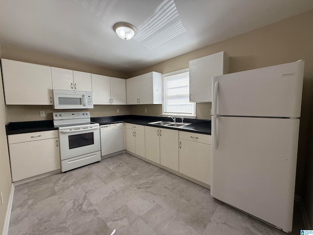 kitchen featuring white cabinets, white appliances, and sink