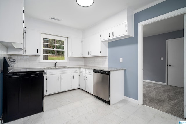 kitchen featuring dishwasher, electric range oven, white cabinetry, and sink