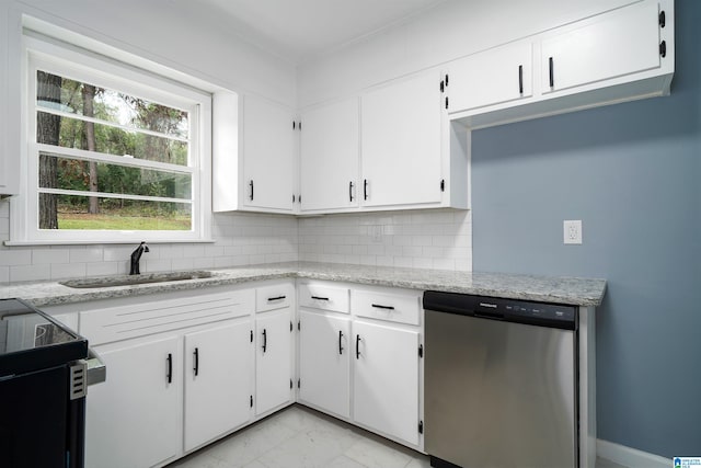 kitchen with backsplash, white cabinetry, dishwasher, and sink