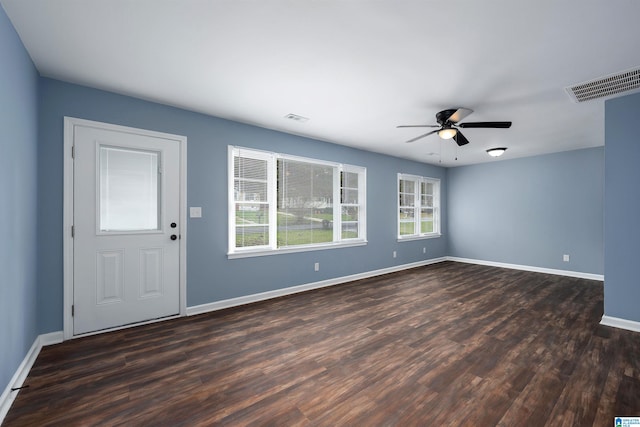 interior space featuring ceiling fan and dark wood-type flooring