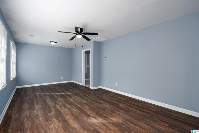 unfurnished room with ceiling fan and dark hardwood / wood-style floors