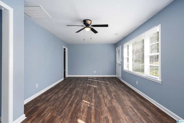 unfurnished room with dark hardwood / wood-style floors and ceiling fan