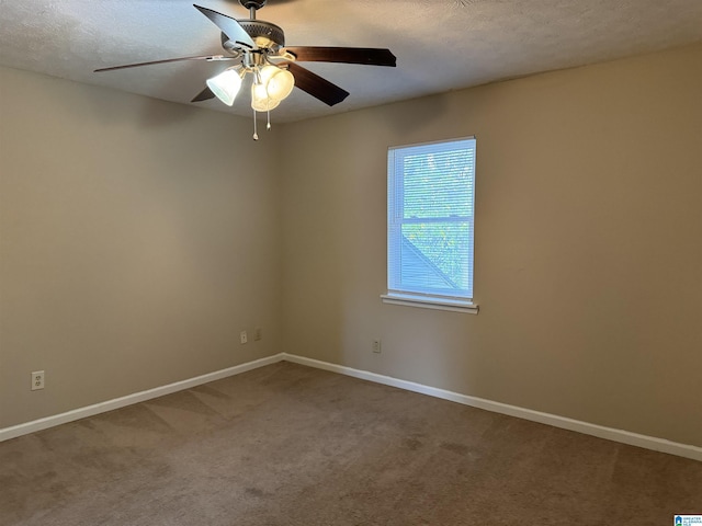5807 Woodgate Cir, Anniston, AL 36207 - carpeted spare room with baseboards, a ceiling fan, and a textured ceiling