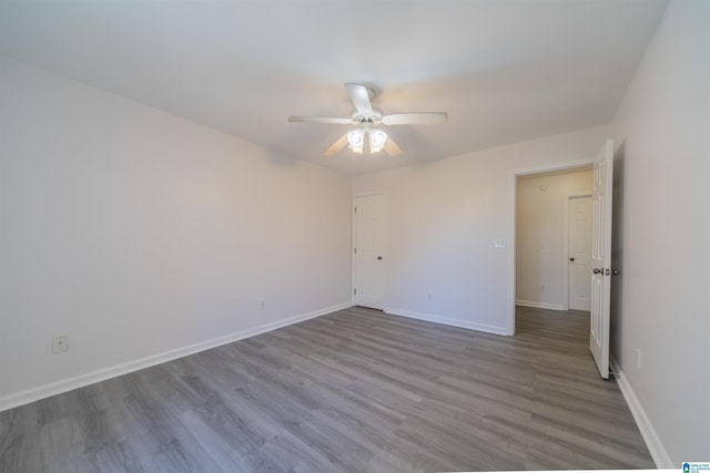 spare room featuring ceiling fan and light wood-type flooring