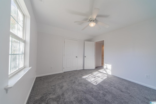 unfurnished room with carpet and ceiling fan