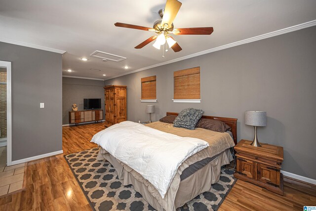 bedroom featuring ceiling fan, ornamental molding, and light wood-type flooring