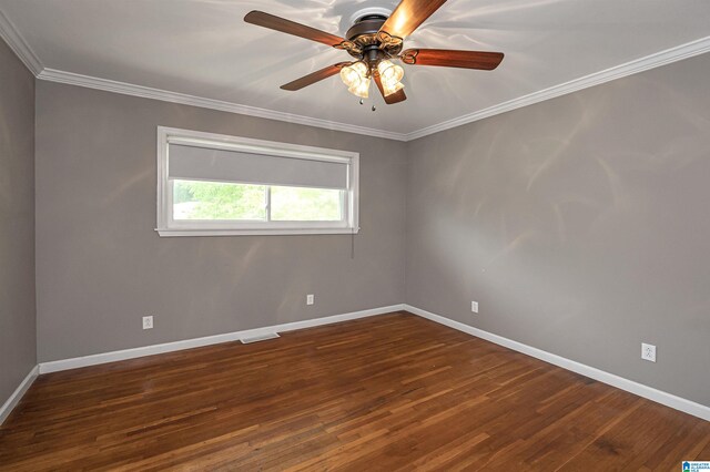 spare room featuring dark hardwood / wood-style floors, ceiling fan, and ornamental molding